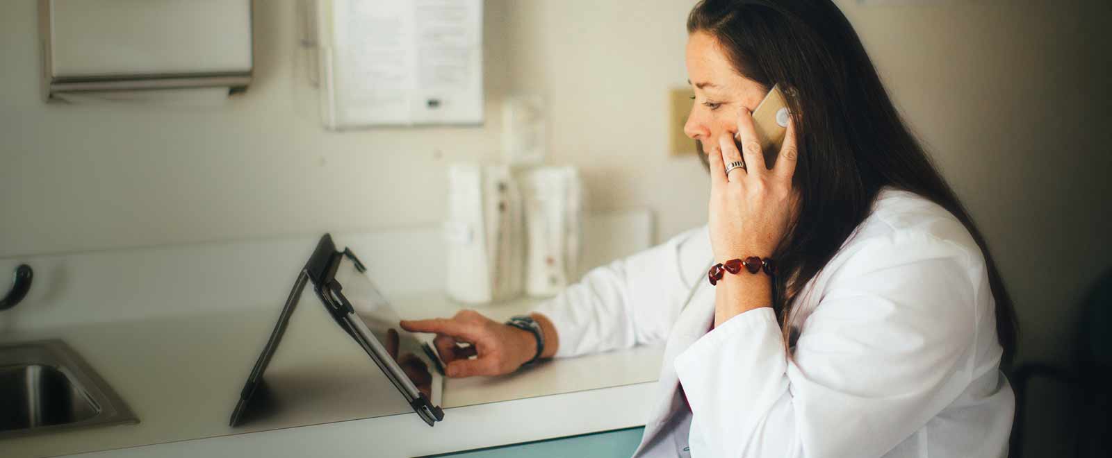Clinician reviewing remote vitals